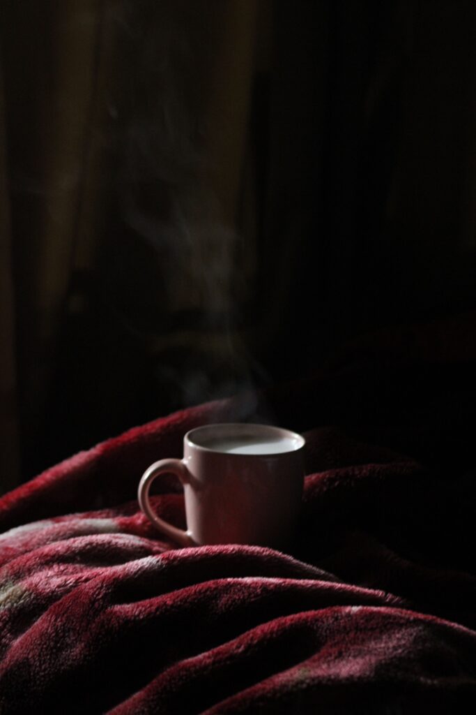 Coffee and a weekly planner arranged for a simple Sunday reset before a new week